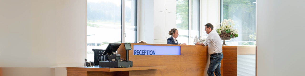 Reception Staff with guest at Rehaklinik Zihlschlacht