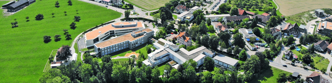 Aerial view of Rehaklinik Zihlschlacht and green surrounding landscape